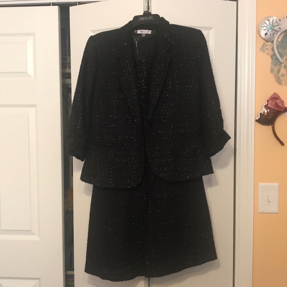Jennifer Lopez black cocktail dress with jacket.
